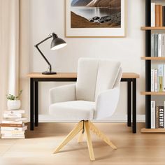 a white chair sitting in front of a desk with a lamp on top of it