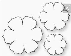 three flowers cut out from paper on a white background