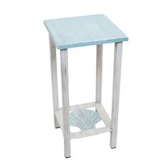 a white and blue side table with a shell on the bottom, against a white background