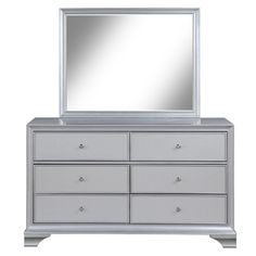 a silver dresser with a mirror on top and drawers below it, against a white background