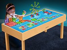 Use our spacious table to encourage light and color exploration�and even inspire scientific inquiry! An extra-wide surface lets lots of children play and explore as the table lights up in 4 vibrant colors. It's even wide enough to fit two of our Light Table Sensory Trays side by side (sold separately below)! Plus, a handy remote makes it easy to dim the lights, change the colors�or make the lights flash through the rainbow. The plug-in table features a wooden frame and an acrylic, LED-illuminate Light Experiments, Magnetic Building Tiles, Bright Table, Lakeshore Learning, Classroom Tables, Hardwood Table, Classroom Furniture, Color Changing Lights, Light Bright