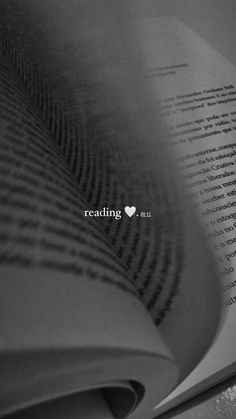 an open book with the word reading on it's page and a heart in the middle