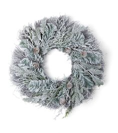 a christmas wreath with pine cones and needles