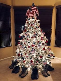 a white christmas tree with red, white and blue decorations