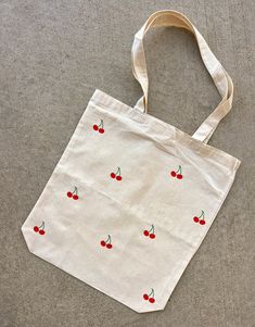 "A simple and super cute cherry tote! Made with Heat Transfer Vinyl Tote info: 15\"x15\" Length and Width 21\" Handles Web Handles Bottom gusset  Please allow 5-7 business days for our processing time as all of our totes are handmade! :) Message for any questions!" Simple Bag Design Ideas, Simple Bag Design, Fruit Tote Bag Painting, Simple Tote Bag Design Paint, Tote Bag Design Ideas Paint Easy, Cute Canvas Tote Bags, Tout Bag Ideas, Diy Tote Bag Painting Ideas Summer, Easy Tote Bag Design