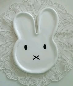 a white plate with a bunny face on it