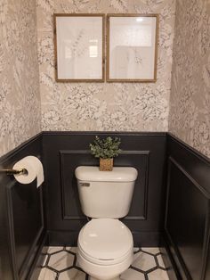 a white toilet sitting inside of a bathroom