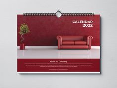 a wall calendar with a red couch and potted plant