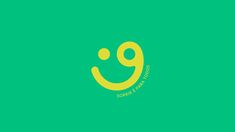 a green and yellow logo with the word smile on it