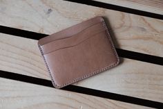 a wallet sitting on top of a wooden table