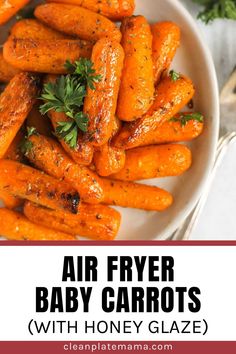 air fryer baby carrots with honey glaze in a white bowl on a table