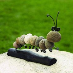 a group of stones sitting on top of a piece of wood