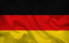 the flag of germany is waving in the wind with its colors red, yellow and black