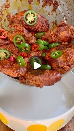 a white plate topped with fried food on top of a wooden table