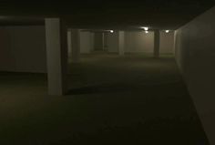 an empty parking garage at night with no people in the room or on the ground