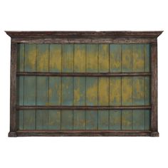 an old wooden shelf with green paint on it