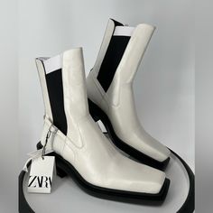 New With Tags. Slip On With Black Stretch Fabric For A Good Fit At The Ankle. Heel Is 2” Boot Shaft Is 8” Toe Box Measures 3” At Widest Part. Toe To Heel Length Measures 11 1/2” When You Exclude The Black Sole. White Leather Ankle Boots, Silver Boots, Boots Square Toe, Zara White, Zara Shoes, Black Stretch, Leather Ankle Boots, White Leather, Bootie Boots