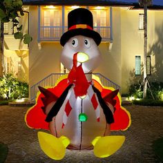 a large inflatable turkey with a top hat and tail