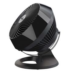 a black fan sitting on top of a metal stand in front of a white background