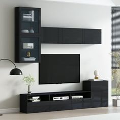 a modern living room with black entertainment center