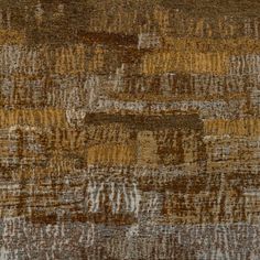 an area rug with different colors and patterns on the surface, including brown, tan, beige