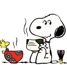 a cartoon snoopy holding a cup and whisk next to a bowl with a bird on it