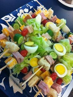 the food is prepared on skewers and ready to be eaten at the table