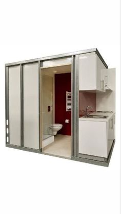 an open bathroom with white cabinets and red walls