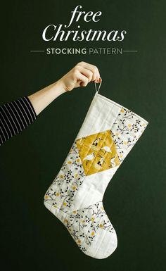 a hand holding a christmas stocking with the words free christmas stockings written on it