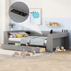 a child's bedroom with blue walls and wooden flooring, including a grey daybed