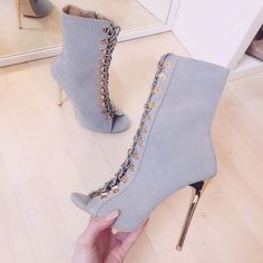 Elevate your style with these Grey Peep Toe Summer Sandal Booties. Featuring lace-up detailing, stiletto heels, and a trendy peep-toe design, these ankle boots are perfect for summer chic looks. Color: Grey Material: Vegan suede Heel Type: Stiletto heel Heel Height: 4.72" / 120 mm approx Product measurements were taken using size 8. Please note that measurements may vary by size. Toe: Peep toe Lace-up design Side zipper closure Handcrafted US sizing. Fits true to size. Gray High Heel Boots For Party, Gray High Heel Party Boots, Party Heels With Front Lace-up Fastening, Chic Fitted Gray Heels, Gray Heels For Spring Party, Gray Summer Party Heels, Gray Party Heels For Spring, Gray High Heels For Spring, Chic Gray Heels For Spring