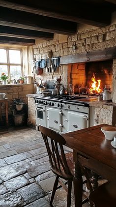 A traditional British cottage kitchen, with exposed stone walls, a large wooden table, and an old-fashioned aga stove. The room is bathed in warm, golden light from a crackling fire, giving it a timeless, cozy atmosphere. hd quality, natural look --ar 9:16 --style raw --v 6.1 Cozy Cooking Aesthetic, Cob Kitchen, Fireplace In Kitchen, Cozy Kitchen Ideas, Kitchen Hearth, Cooking Hearth, Cozy Kitchen Nook, Cozy Kitchen Decor, Fireplace Cooking