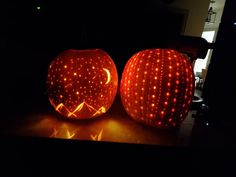 two pumpkins carved to look like they have been carved into the shape of stars