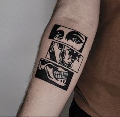 a man with a tattoo on his arm that has two faces and one is looking at the camera