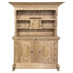 an old wooden hutch with two doors and cupboards on the front, isolated against a white background