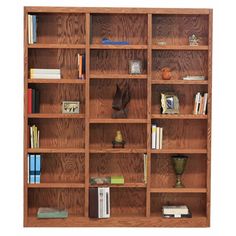 a wooden bookcase filled with lots of books