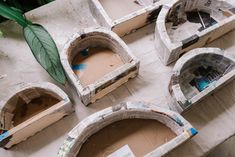 four cardboard boats sitting on top of a table