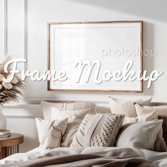 the frame mock up is displayed in front of a bed with pillows and blankets on it