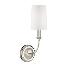 a wall light with a white shade on it