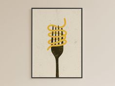 a framed poster with a fork and noodles on it's side hanging on a wall