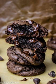 chocolate cookies stacked on top of each other with the words soft thick and decadent double chocolate cookies