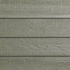 the side of a house with wood siding