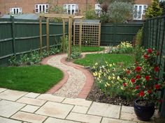 a small garden in the middle of a yard