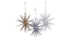 three metal stars hanging from chains on a white background, one is gold and the other is silver