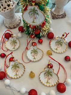 christmas ornaments are arranged on a table