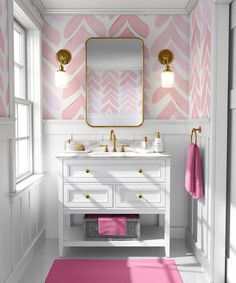 a bathroom with pink rugs and white cabinets