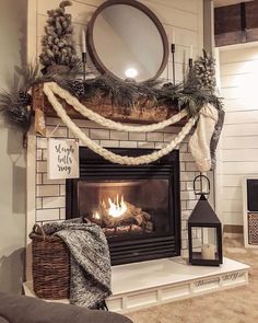 a living room with a fire place and christmas decorations