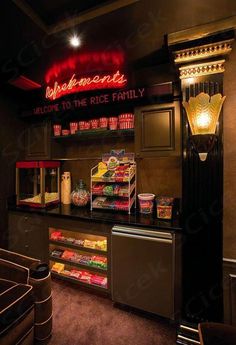 the inside of a fast food restaurant with neon signs above it and snacks on display