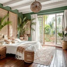 a bedroom with green walls and wooden floors