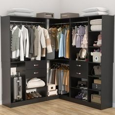 an open closet with clothes and other items